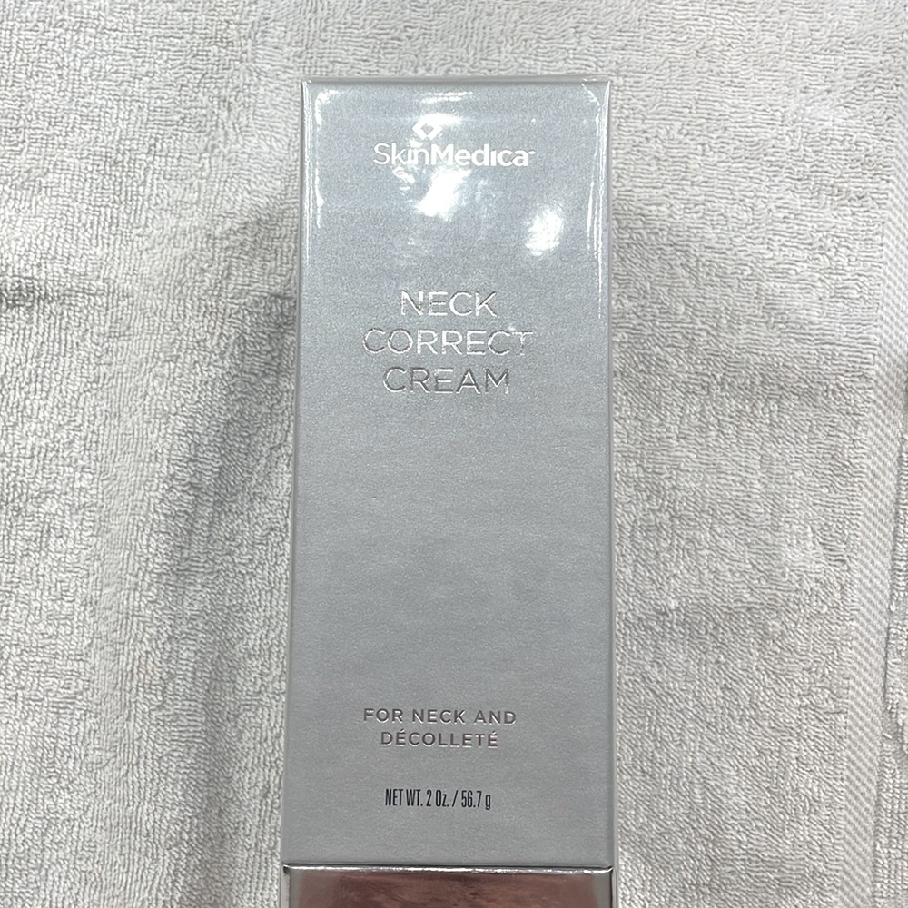 New in box, never opened. SkinMedica Neck Correct Cream. 2 oz.